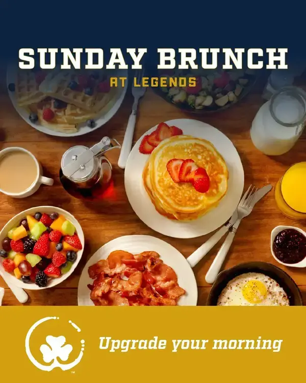 Sunday brunch at Legends features waffles, pancakes, fruit salad, bacon, and fried egg.